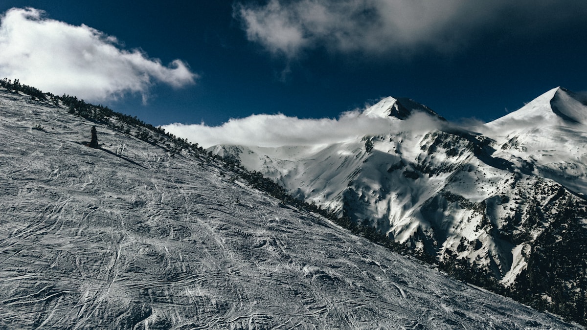 Skier on a snowy slope in Bansko, Pirin Mountains, Bulgaria