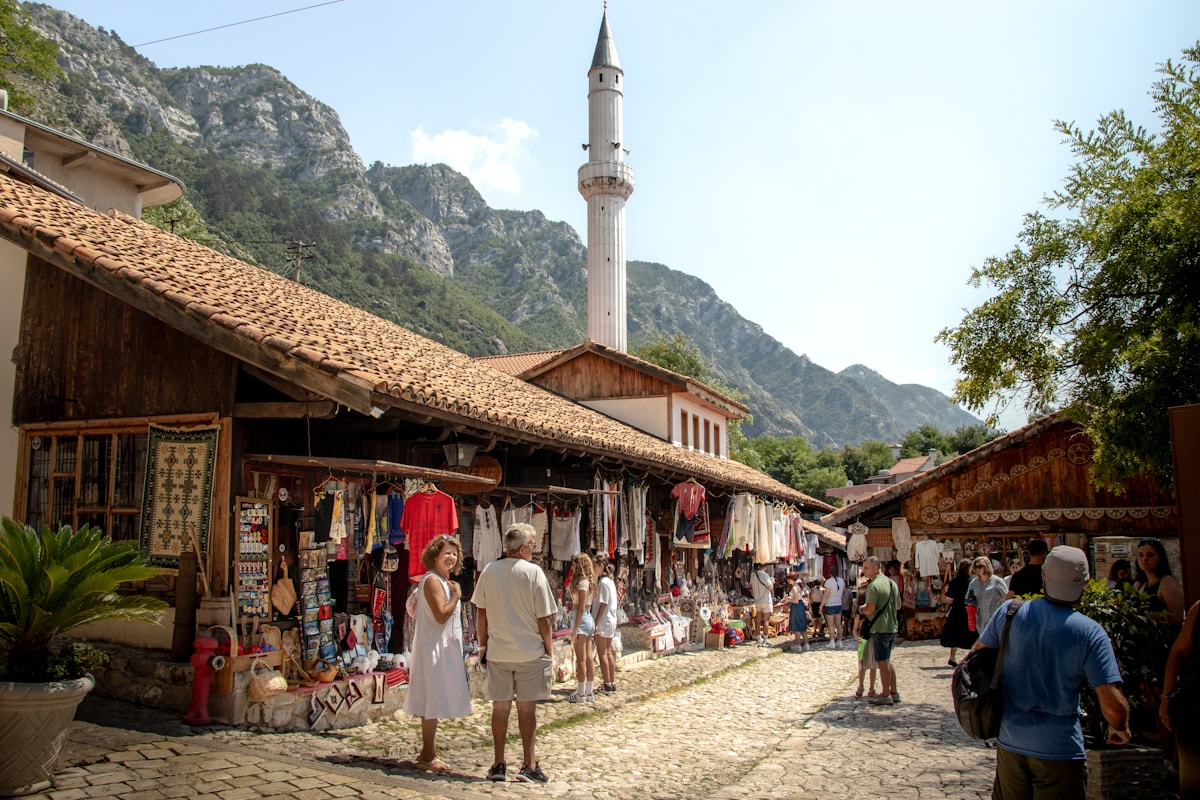 Traditional Albanian craft market in Krujë with handmade goods and rugs