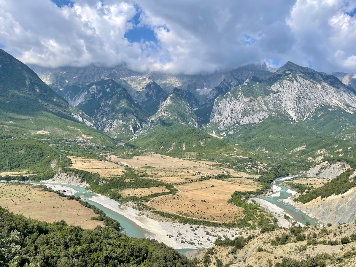 Vjosa River flowing through a mountain valley with Nemercka Mountain, Albania
