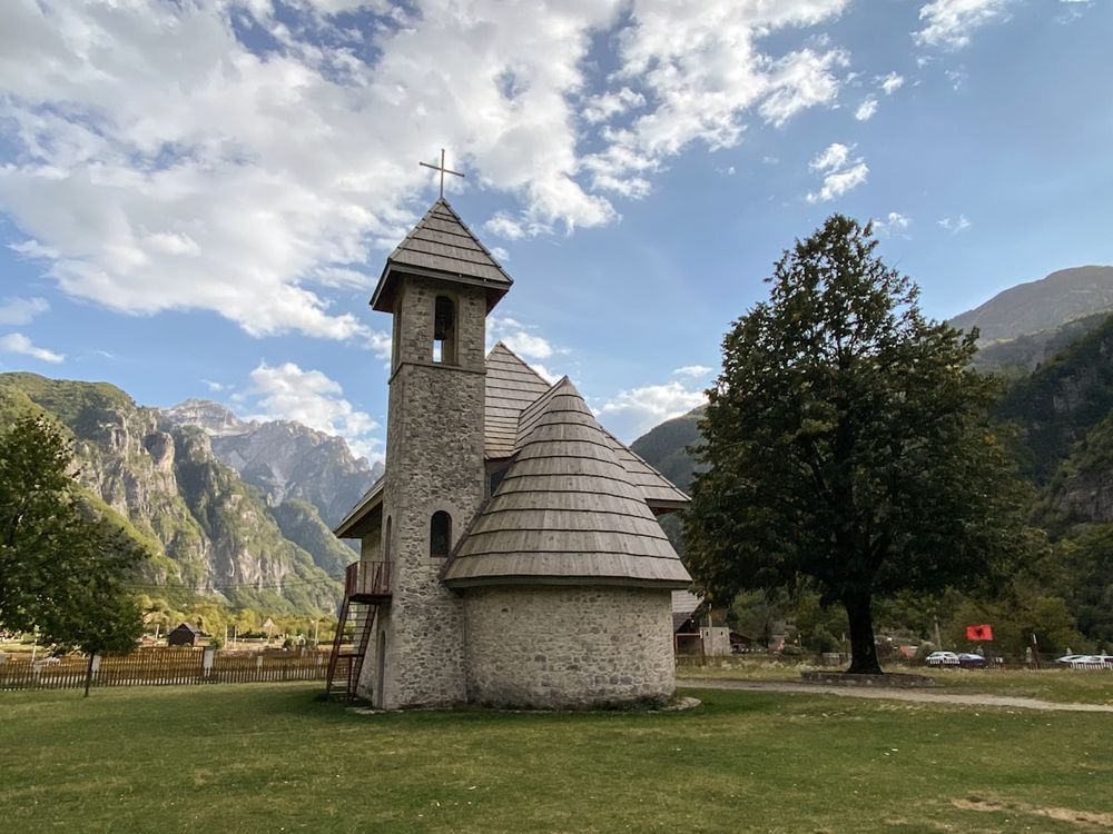 Church of Theth nestled in a green valley, Albanian Alps
