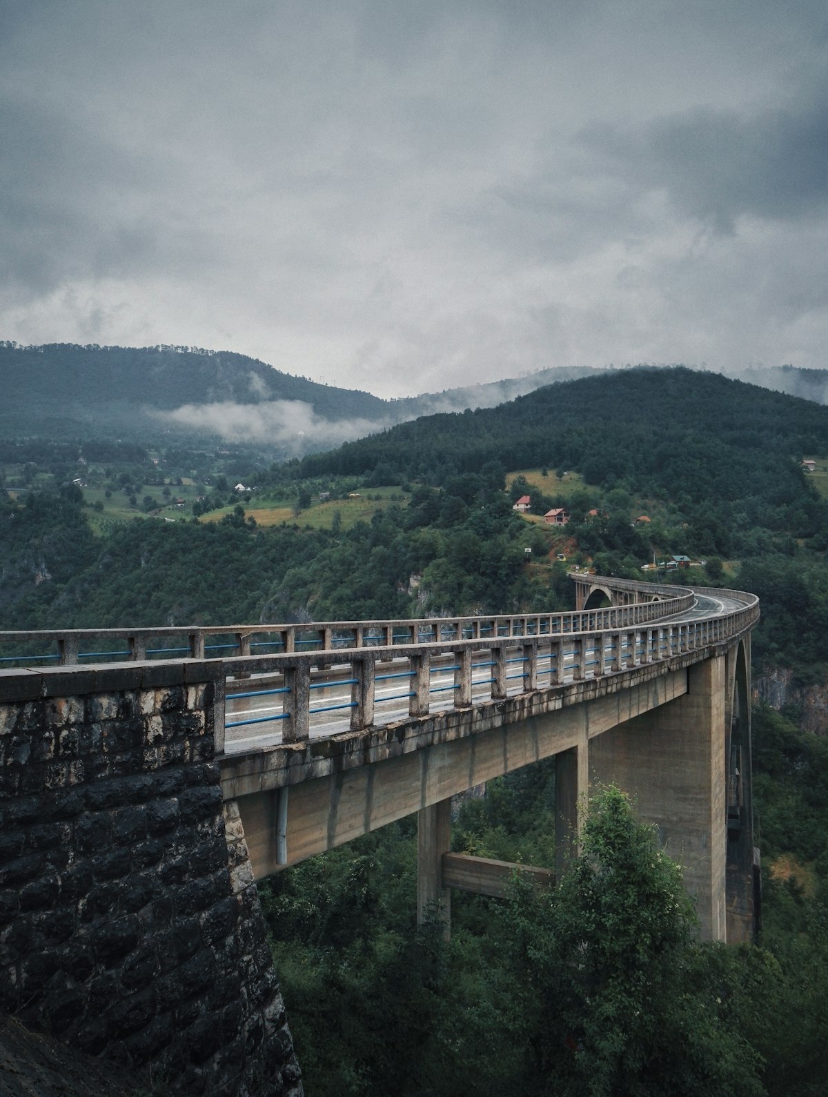 Curved road bridge spanning a deep Balkans river gorge, Montenegro