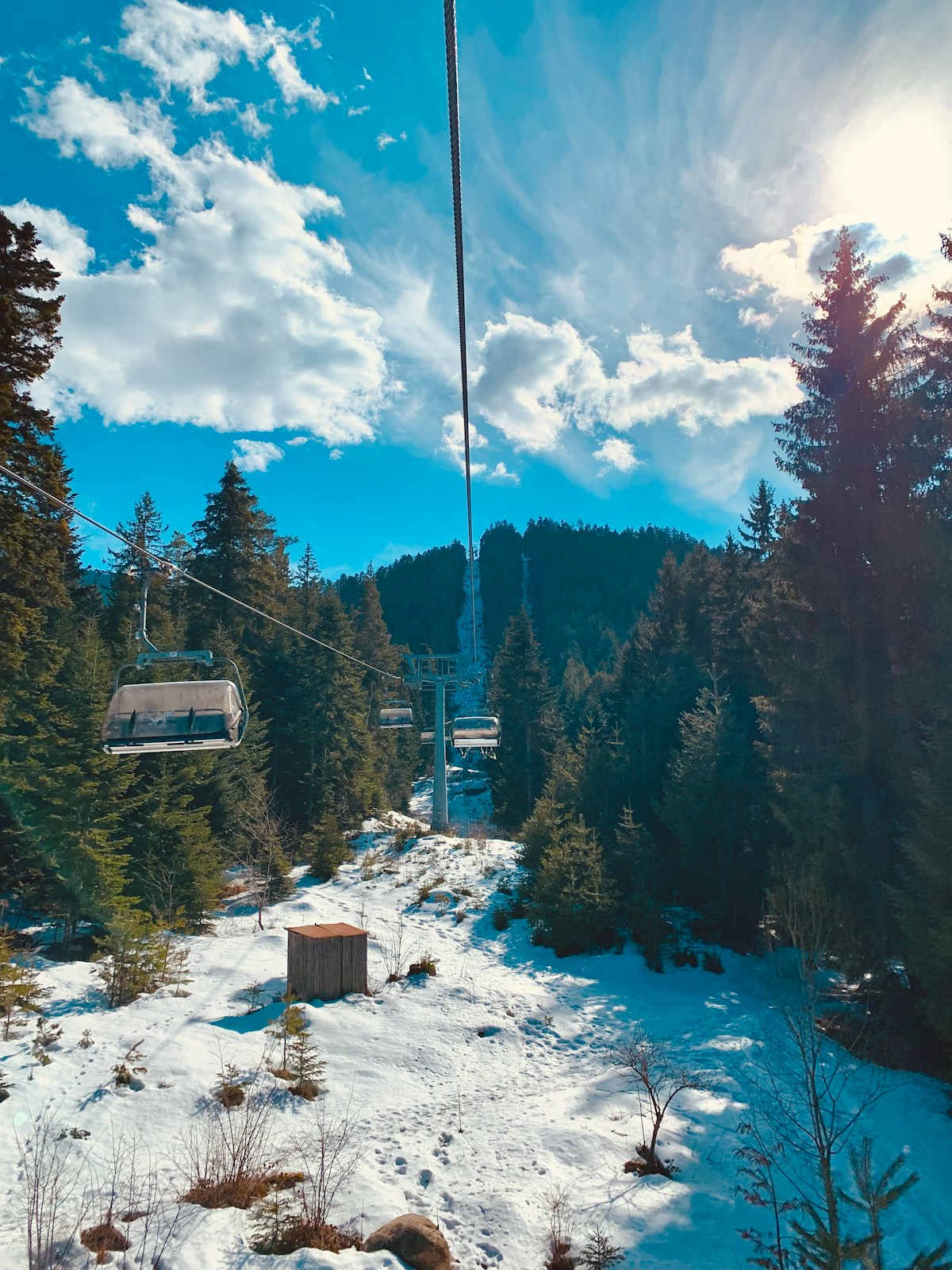 Ski lift going up a snowy slope in Bansko, Bulgaria