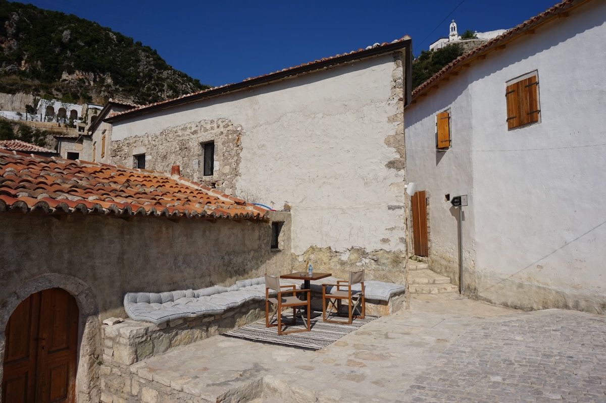 Old town of Dhërmi with white hilltop church on the Albanian Riviera