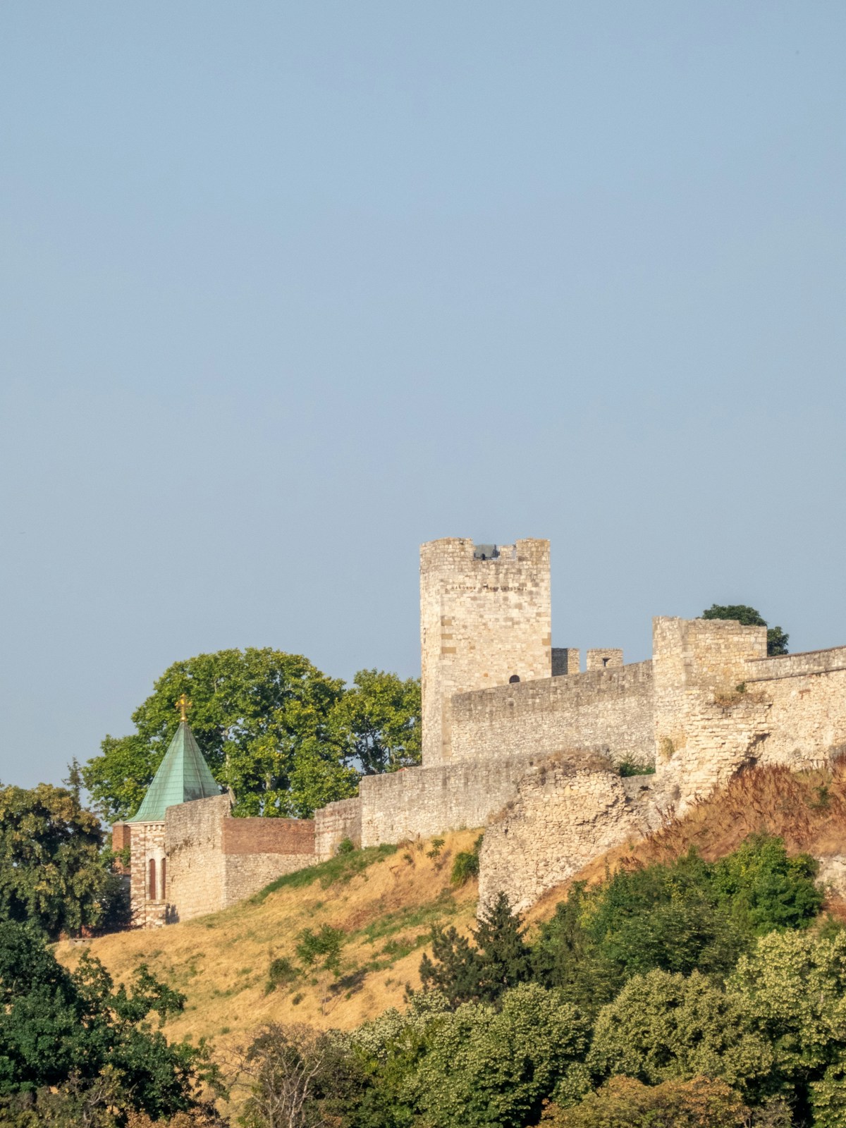 Niš Fortress stone walls and tower on a grassy hill, Serbia