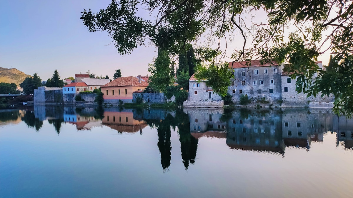Trebišnjica river with trees and old town buildings in Trebinje, Bosnia and Herzegovina