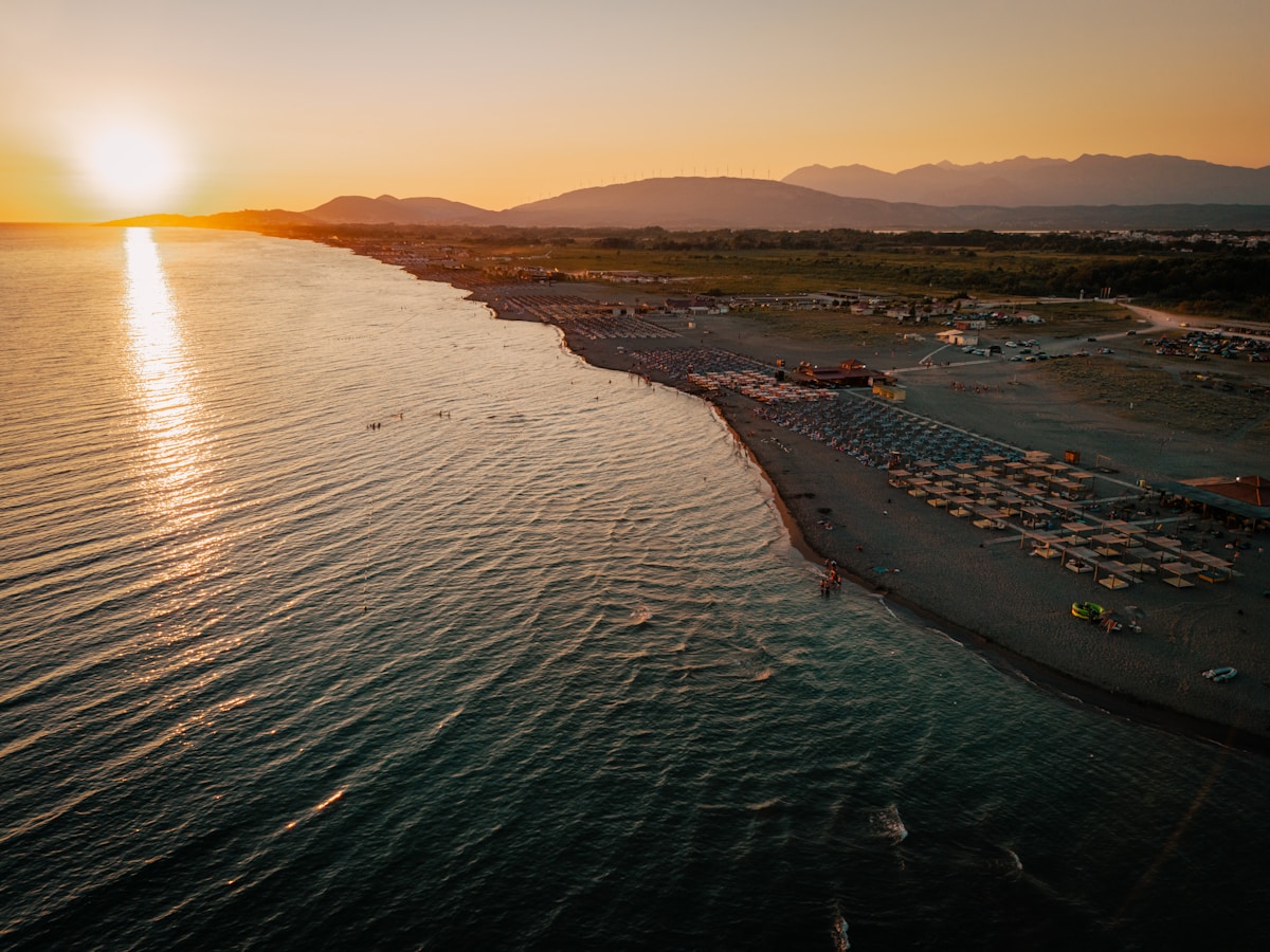 Sunset over Ulcinj beach with umbrellas, Montenegro