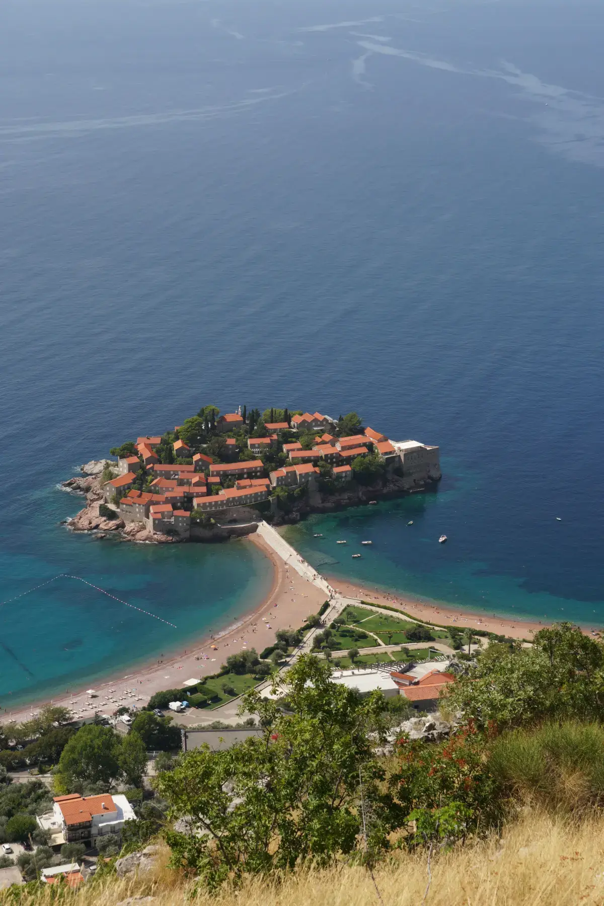 Aerial view of Sveti Stefan island surrounded by turquoise Adriatic water, Montenegro