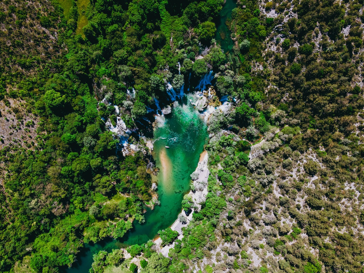 River running through a forested Bosnian valley