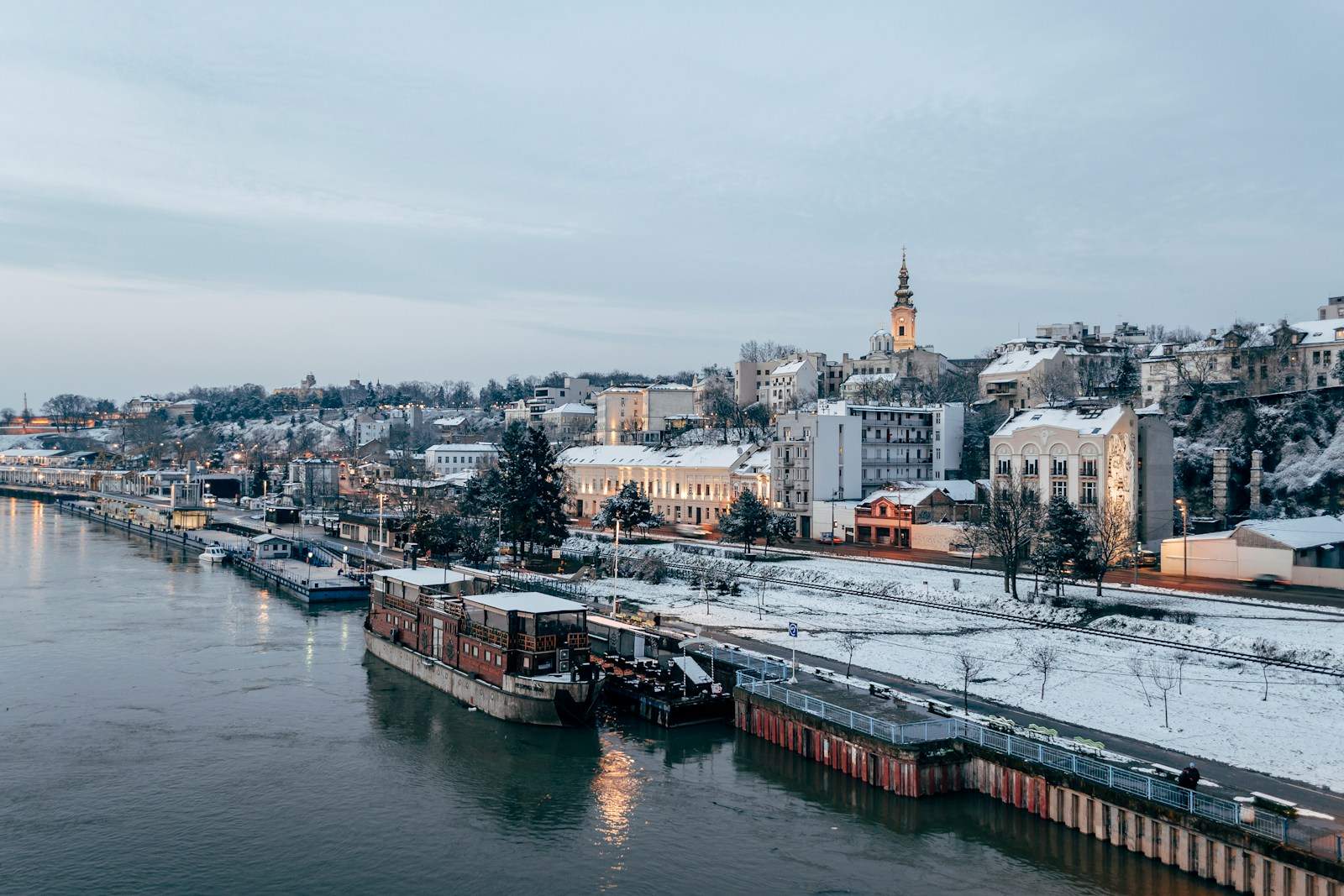 Belgrade waterfront along the Sava river in winter, with the old city on the hillside