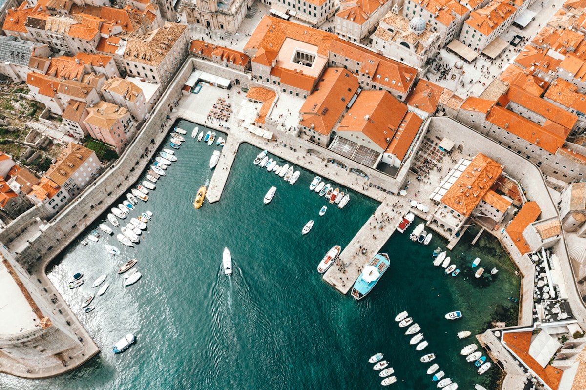Stone table outside a konoba in Dubrovnik's Old Town, Croatia, with the Adriatic sea in the background