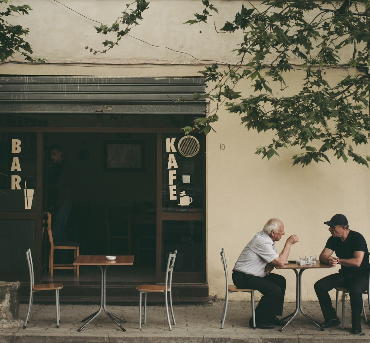 People walking through a street in Durrës city centre, Albania