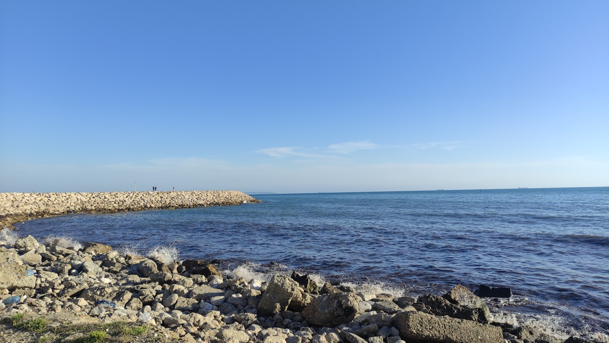 Rocky Adriatic coastline near Durrës, Albania under a clear blue sky