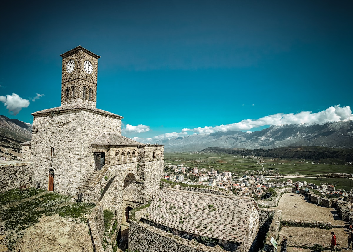 Clock tower on the stone wall of Gjirokaster Castle, Albania