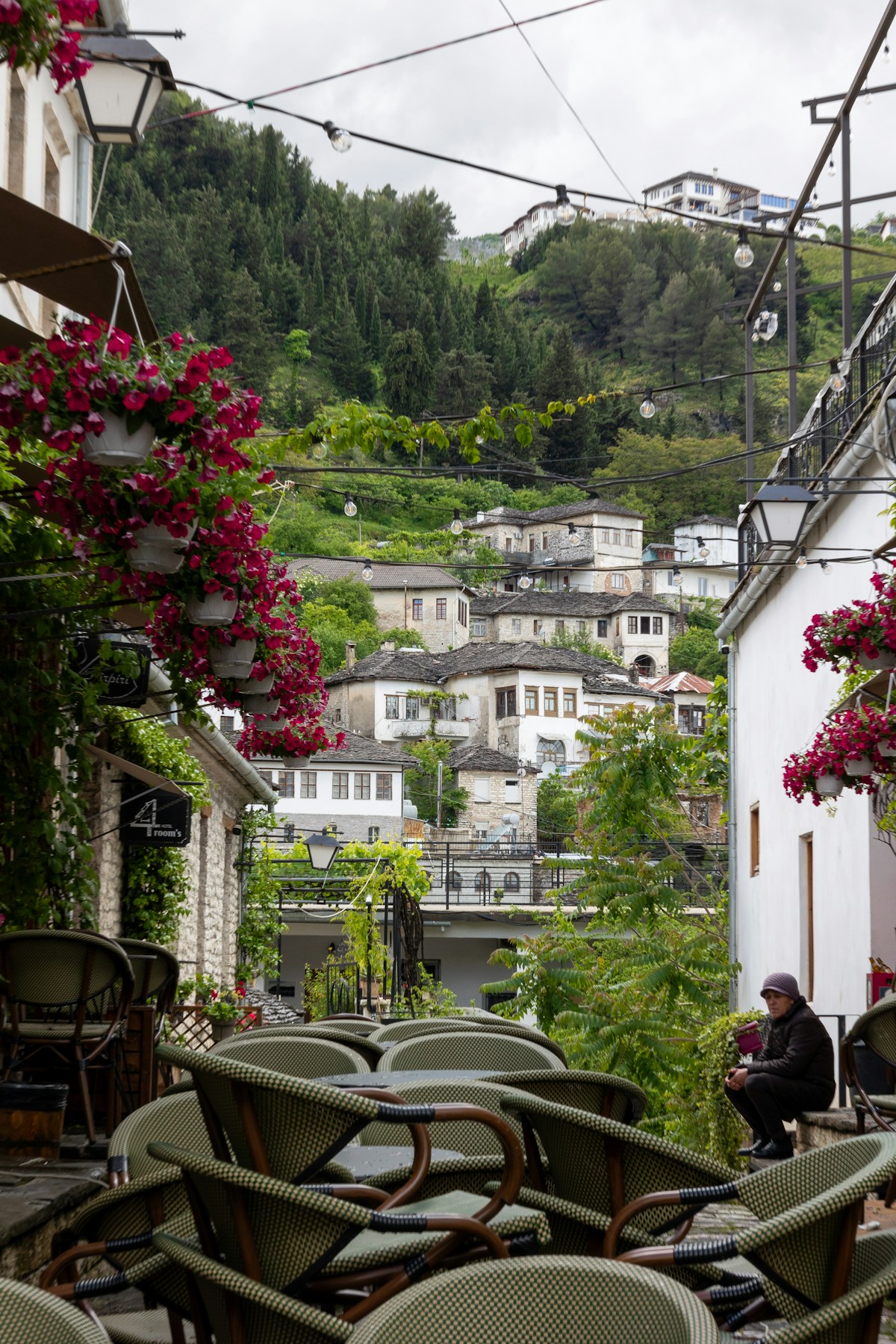 View of Gjirokaster citadel and stone rooftops from a high balcony, Albania