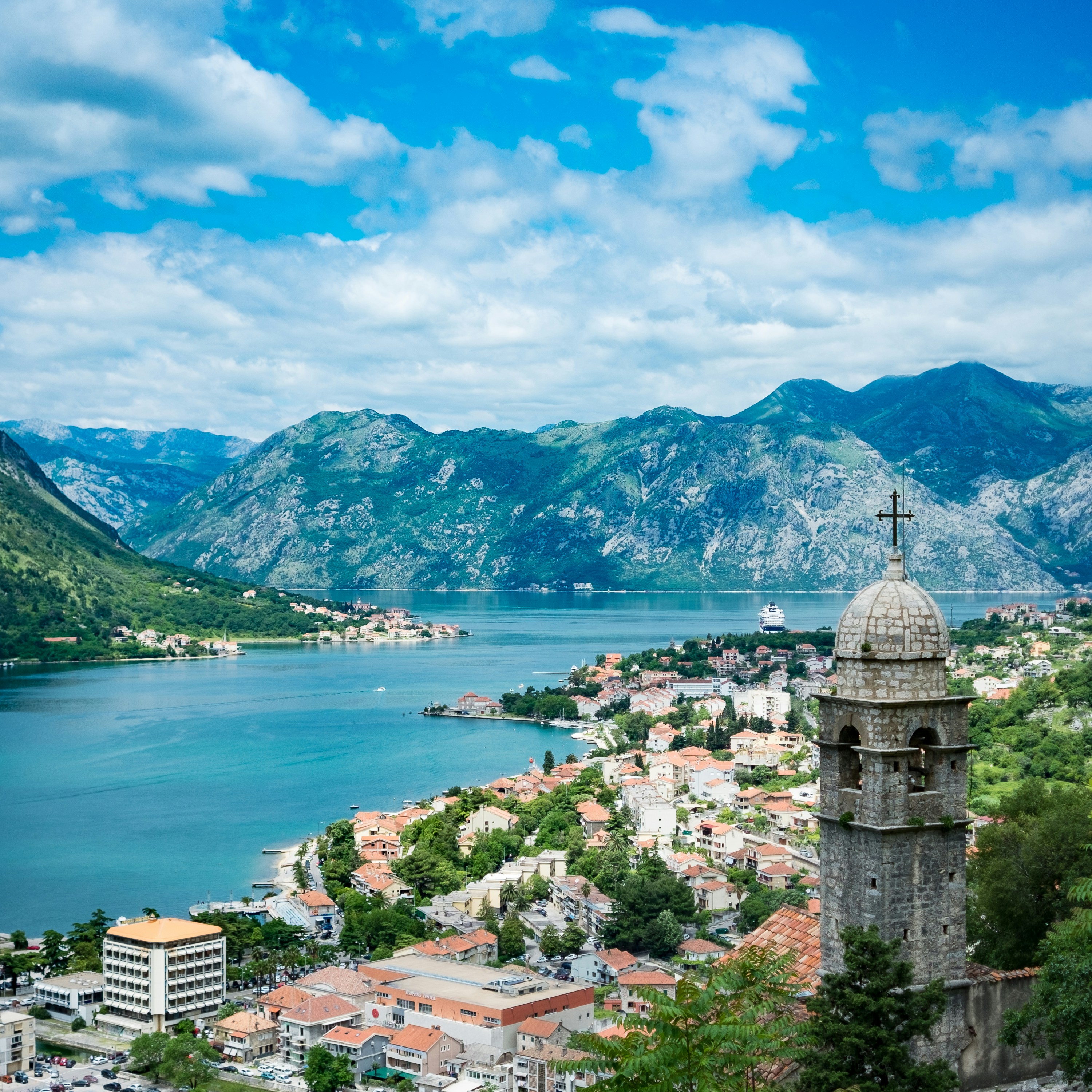 Aerial view of Kotor old town and church tower with the Bay of Kotor behind, Montenegro