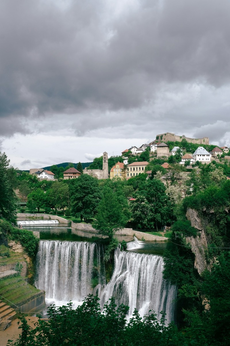 Waterfall through a lush green forest in Bosnia and Herzegovina