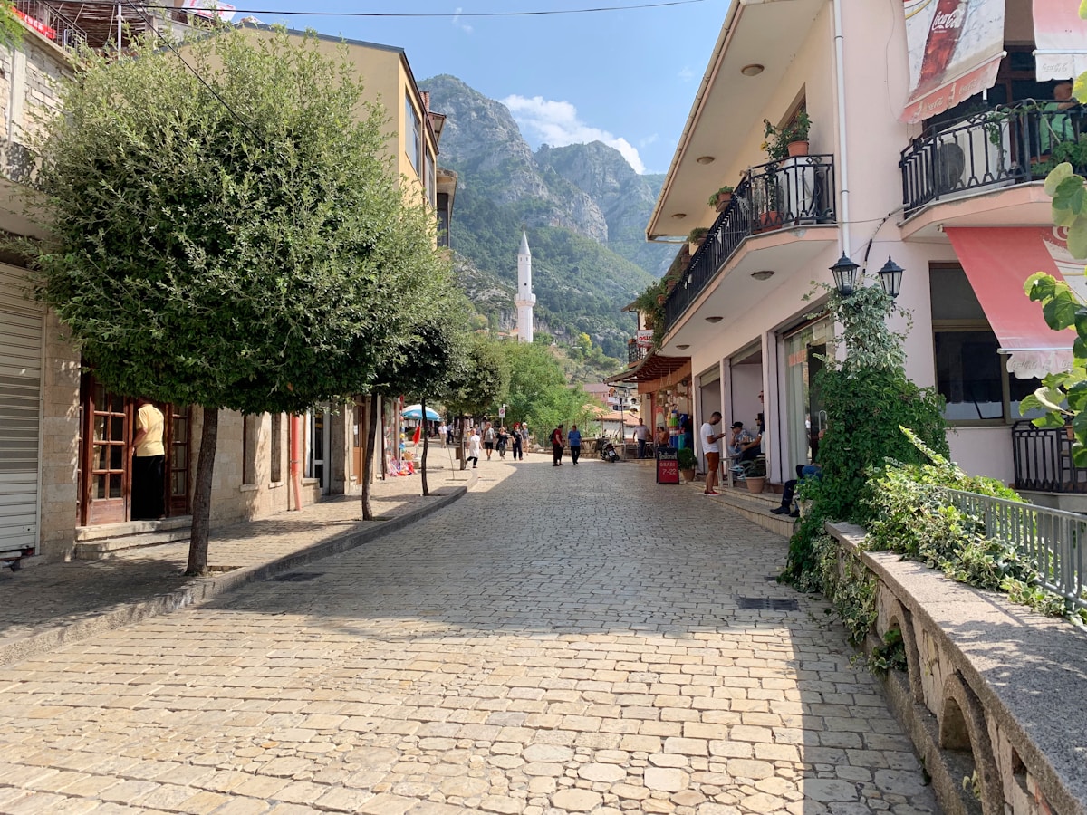 Cobblestone street and stone buildings in Krujë on a clear morning, Albania