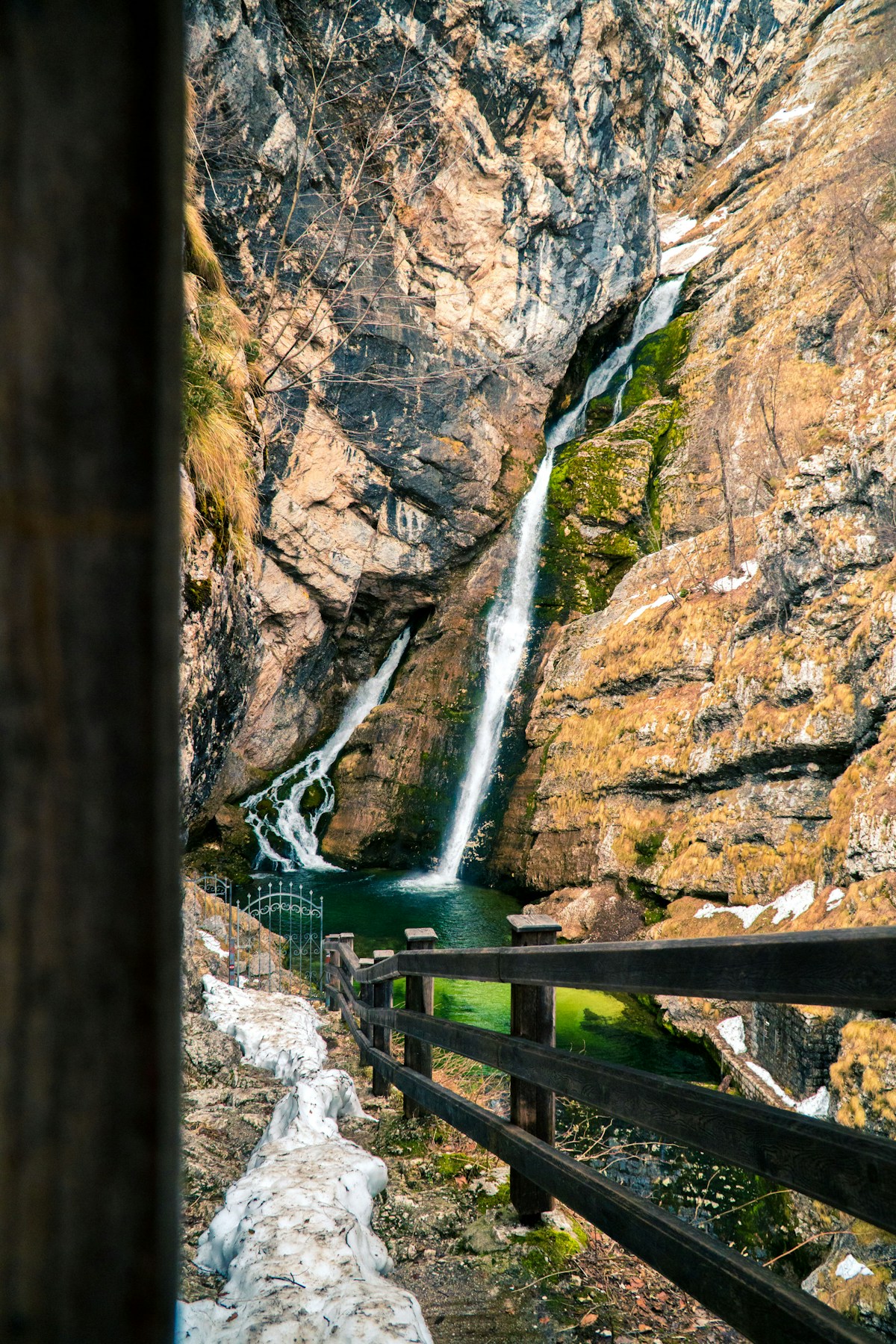 Wooden walkway beside Savica Waterfall in a rocky gorge near Lake Bohinj, Slovenia