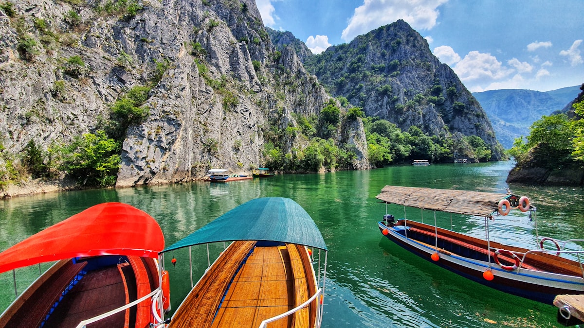 Wooden tourist boats in emerald water at Matka Canyon, North Macedonia