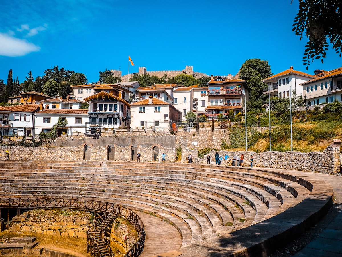 Ancient Roman amphitheater in Ohrid old town with fortress above, North Macedonia
