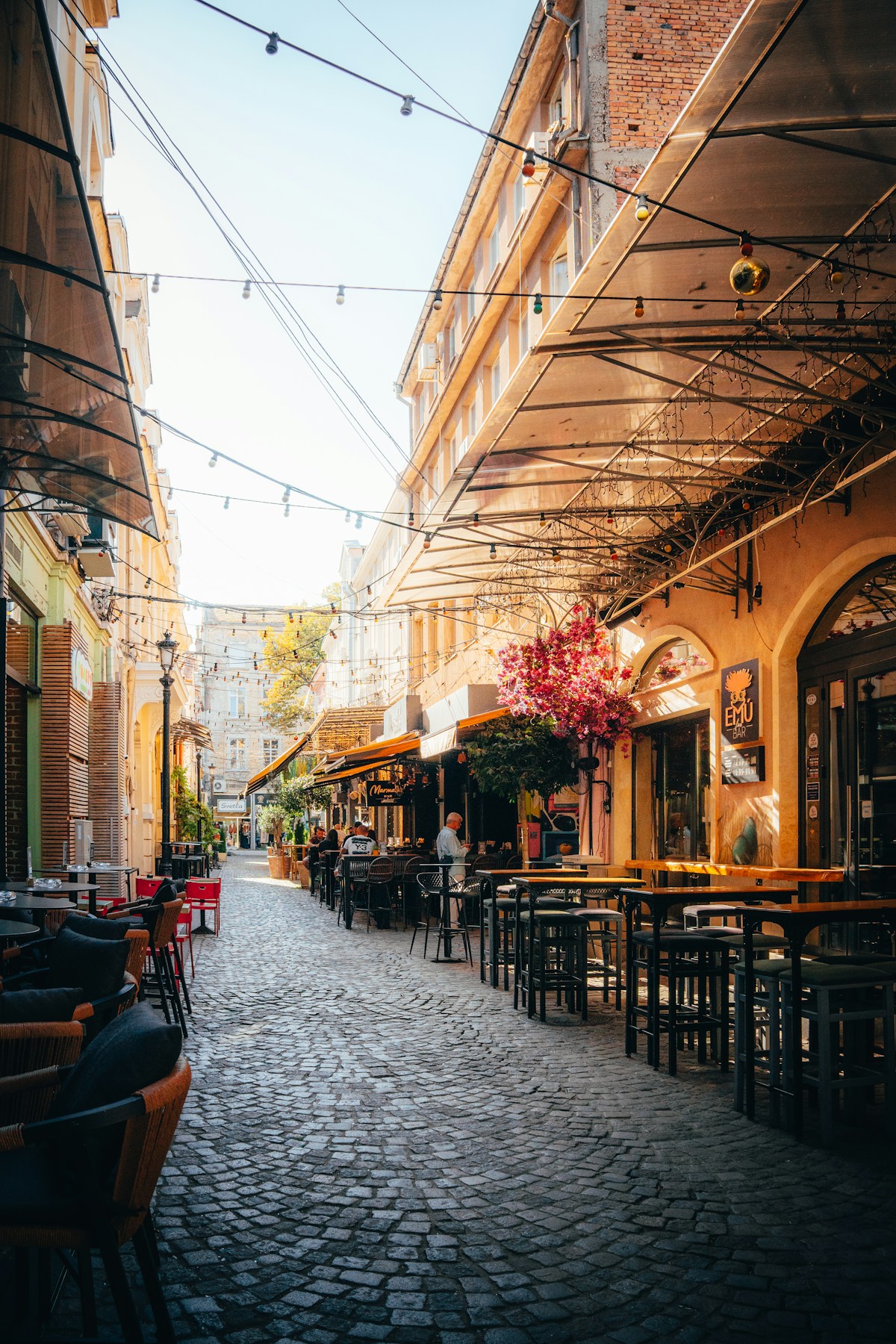 Cobblestone street lined with cafes in Plovdiv, Bulgaria