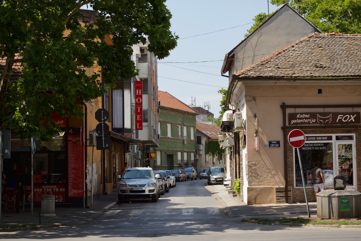 Street with parked cars in Novi Sad, Serbia - transport guide