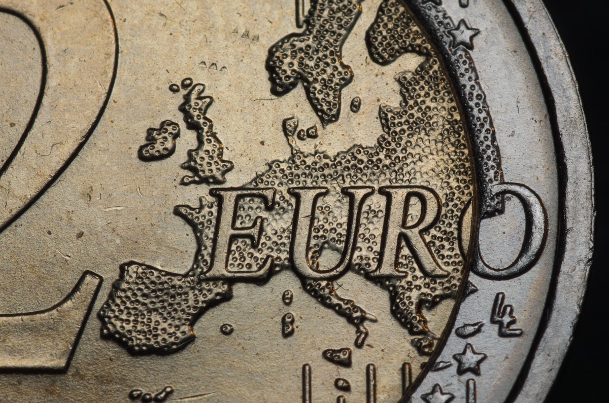 Close-up of a 2 euro coin with Europe map — Balkans currency guide