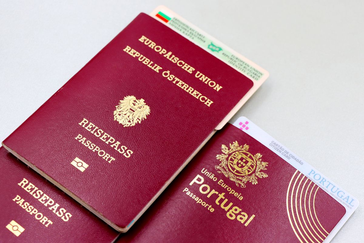 Close-up of European passports and an ID card on a table