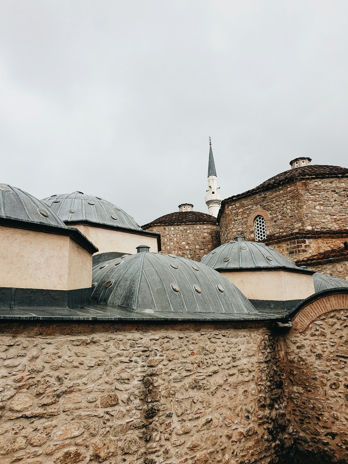 Stone building with clock tower in Prizren, Kosovo