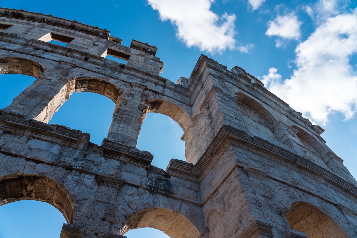 Arched stone facade of Pula Arena, Pula, Istria, Croatia