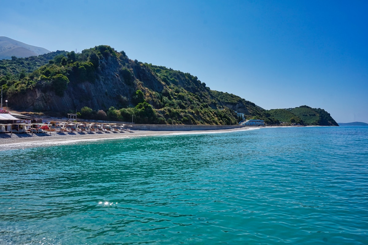 Buneci Beach on the Albanian Riviera with mountain backdrop