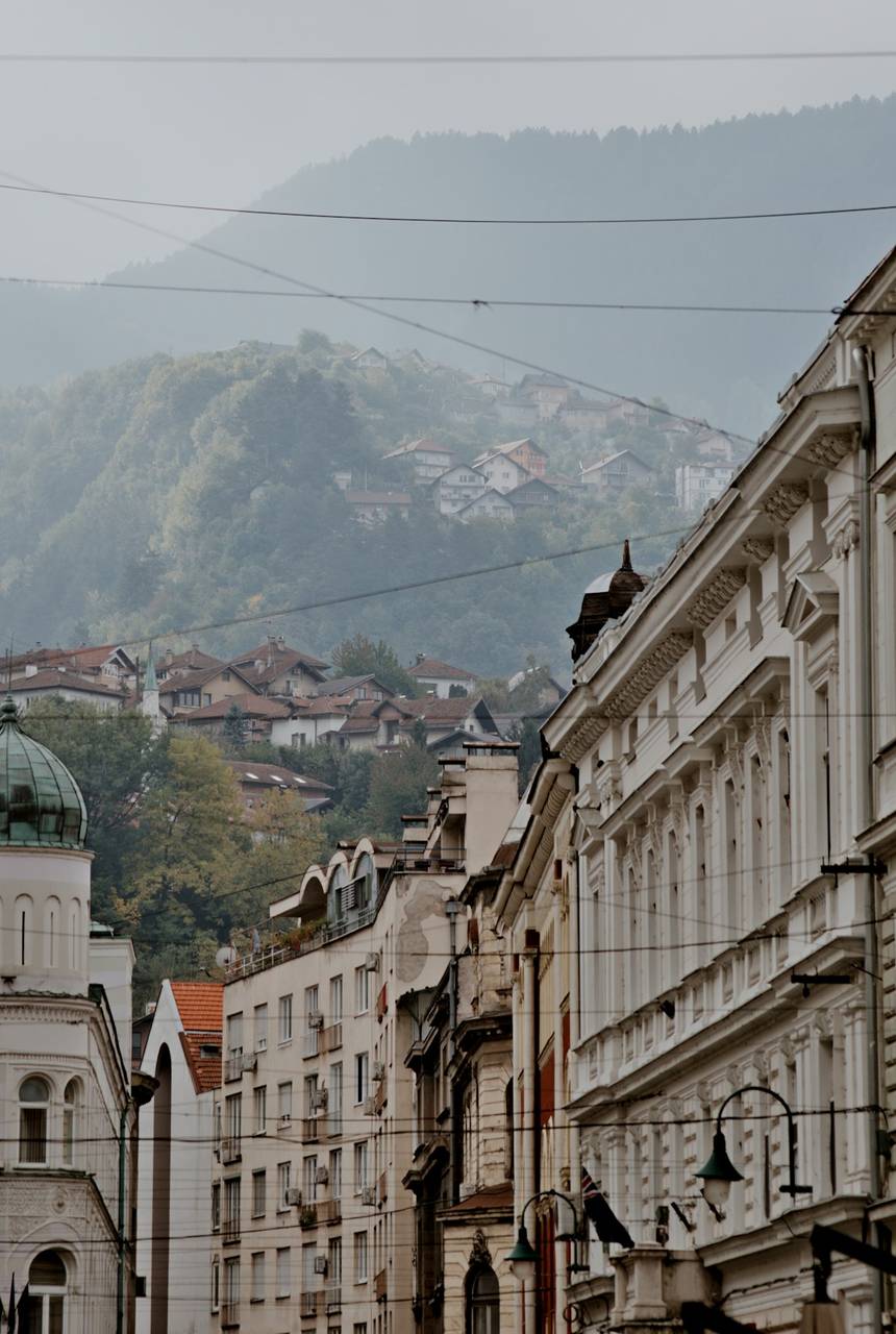 Street with misty mountains behind in Sarajevo, Bosnia and Herzegovina
