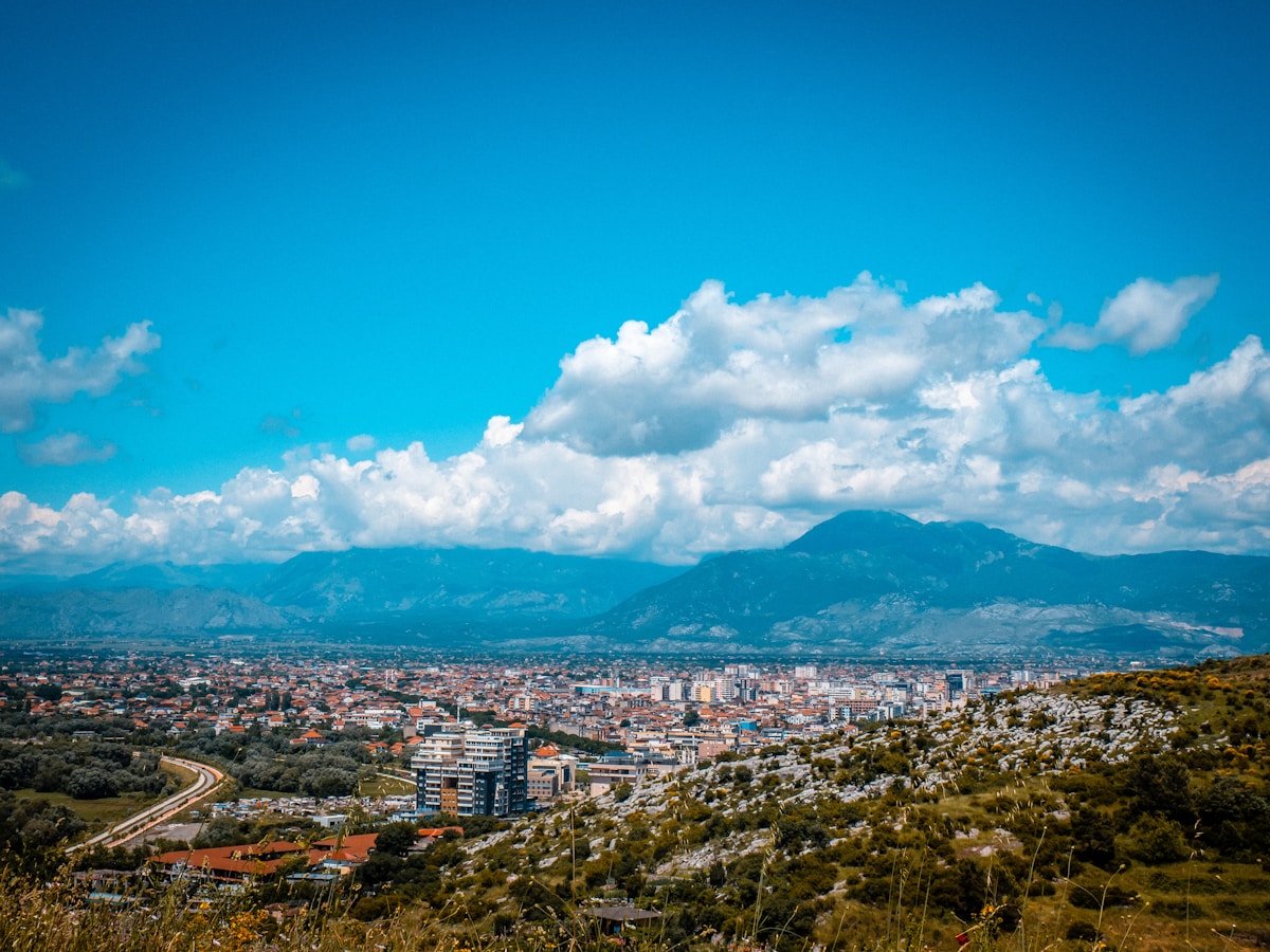 Cityscape of Shkodër with mountains and clear blue sky, Albania