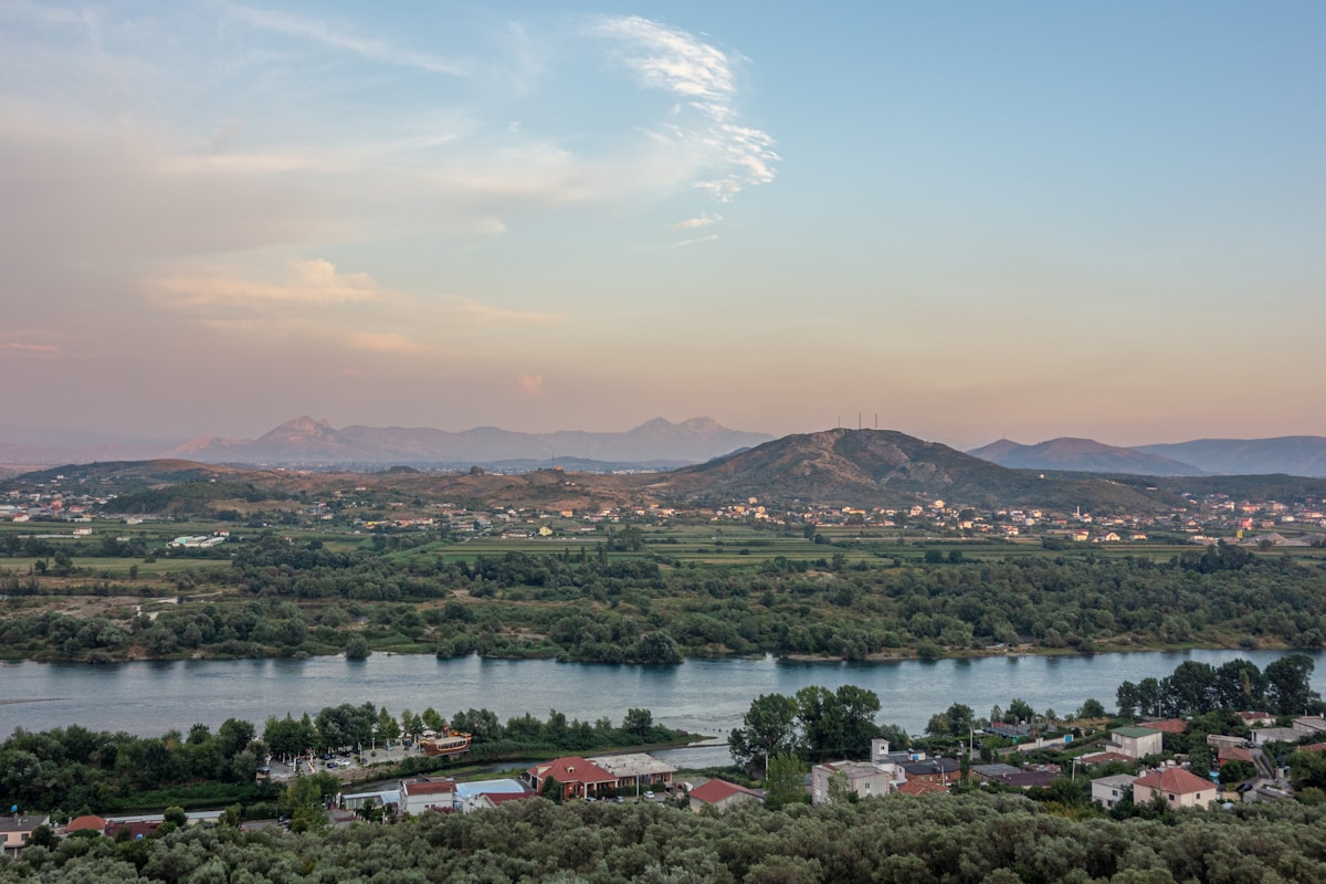 Sunset view over the rooftops and mountains of Shkodër, Albania