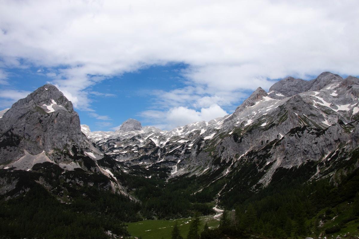 Green mountain slopes under a blue sky in Slovenia