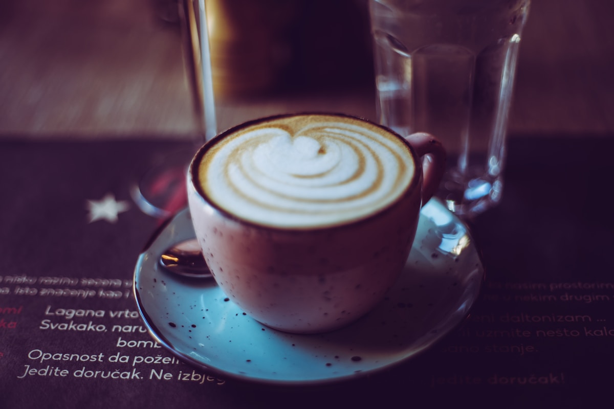 Cup of cafe latte in a cosy European café