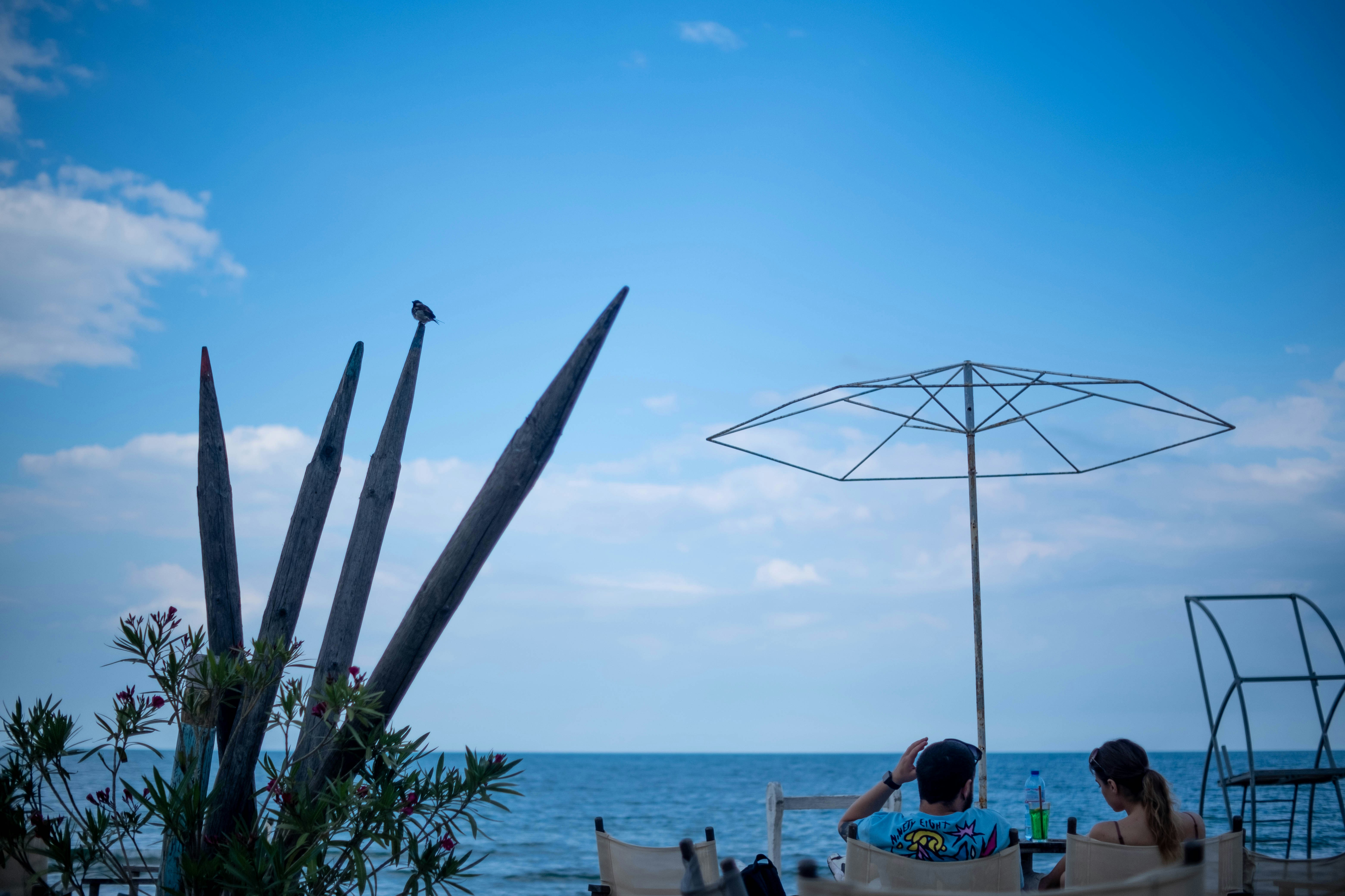 Couple dining at an outdoor table by the Black Sea in Varna, Bulgaria