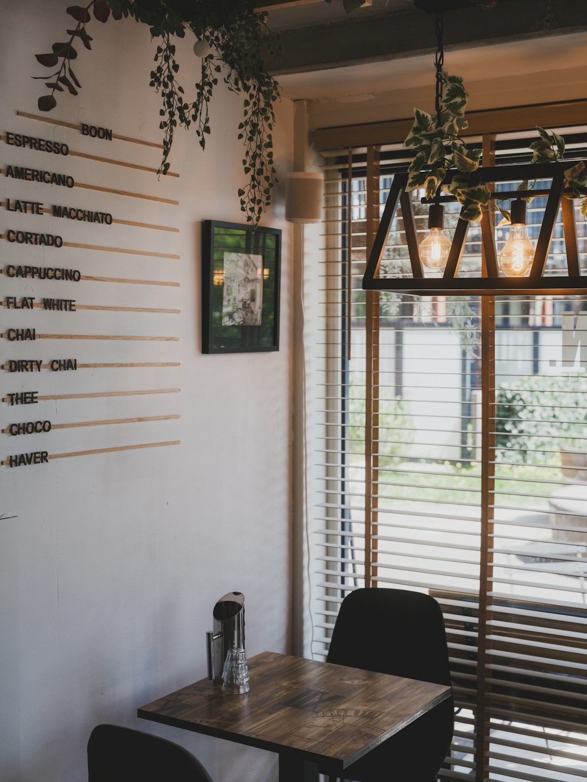 Specialty coffee café with laptop workers at wooden tables in Zagreb, Croatia