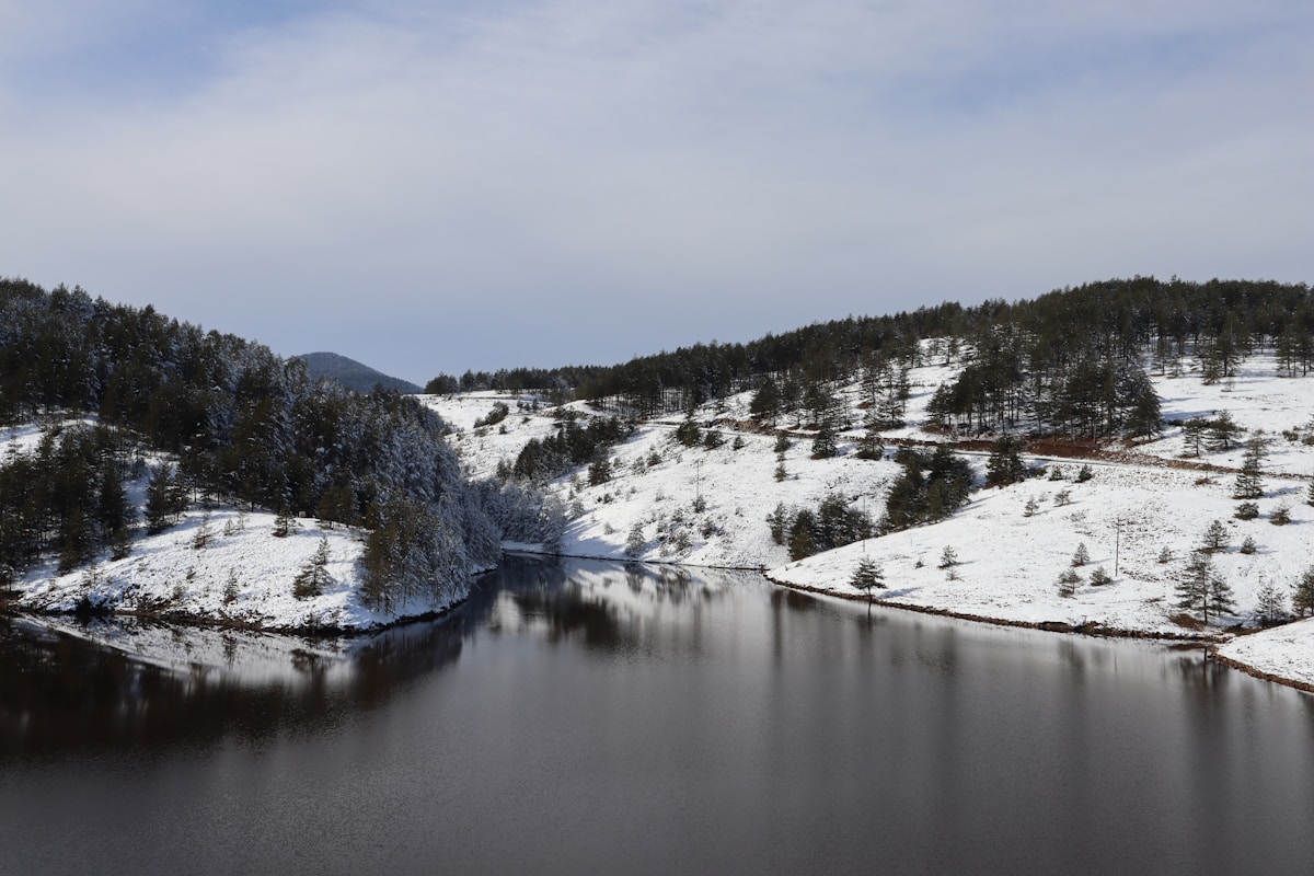 Mountain lake surrounded by snow-covered hills on Zlatibor, Serbia